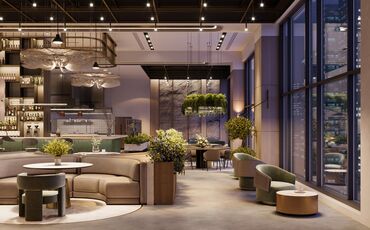 Tische, Sofas mit Hängeleuchten und Pflanzen in einem modernen Hotel